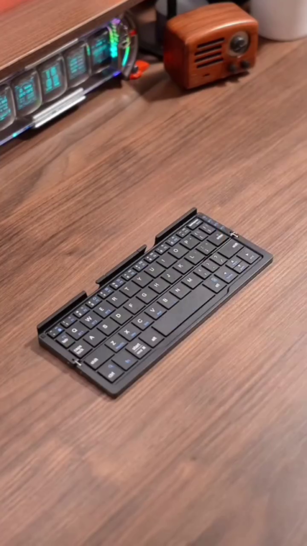Ultra-Compact Foldable Bluetooth Keyboard with Phone Stand - Image 3